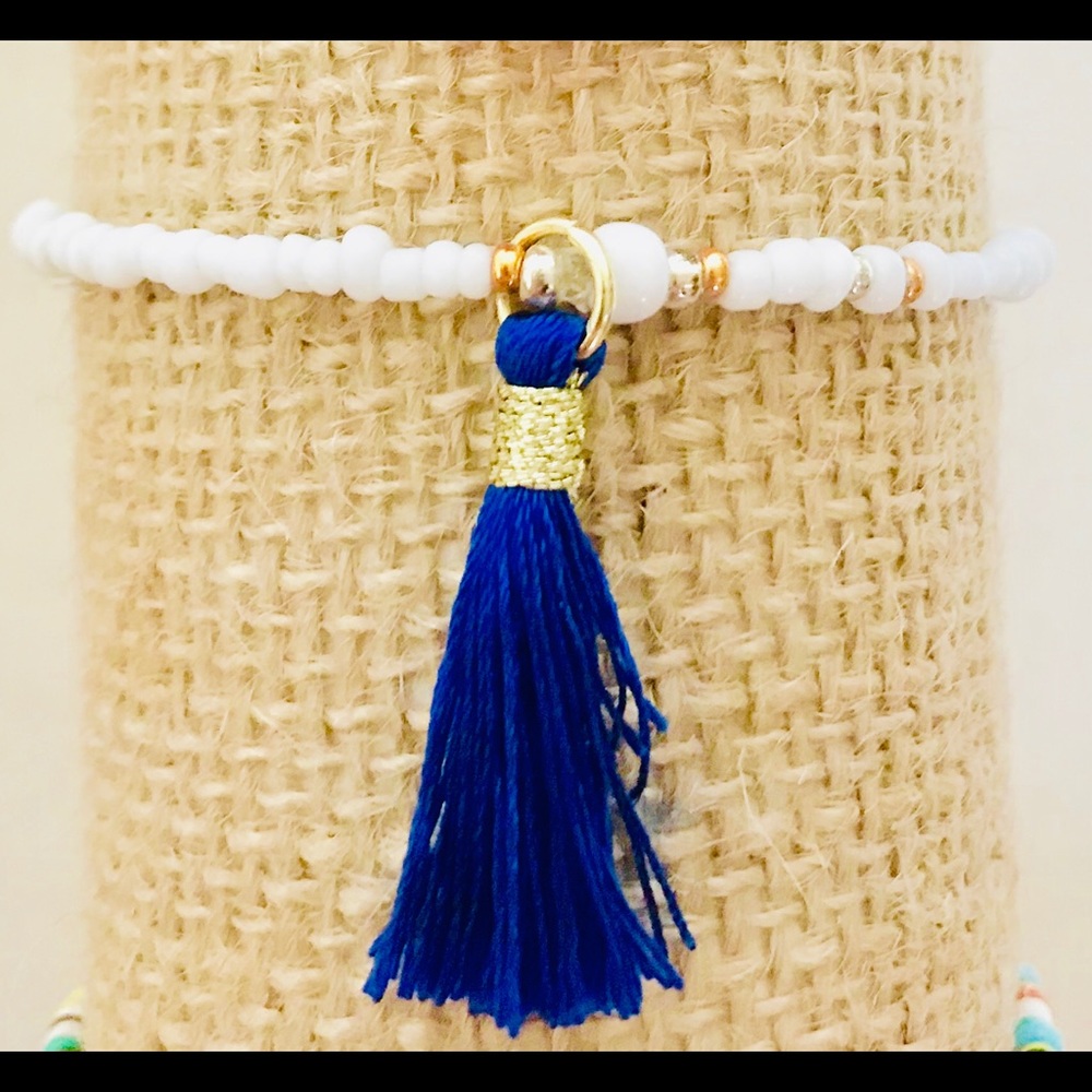 Stretch ankle bracelet white opaque blue tassel